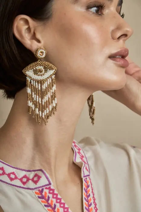 Pendiente óculo flecos